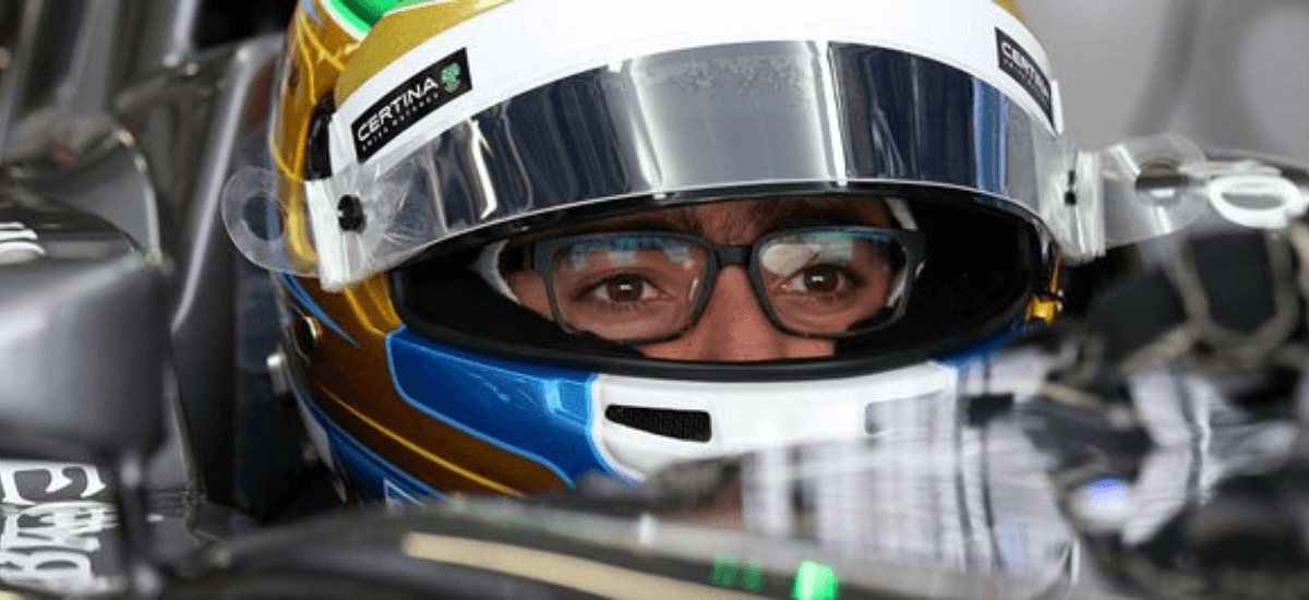 go kart racer wearing a helmet and glasses