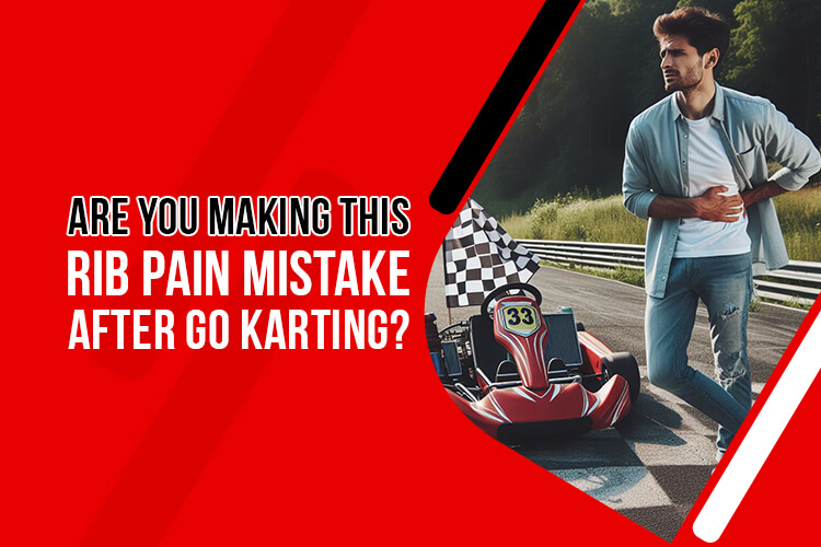 Go-kart driver wincing in pain while holding their ribs after a race, highlighting the risk of rib pain after go karting.